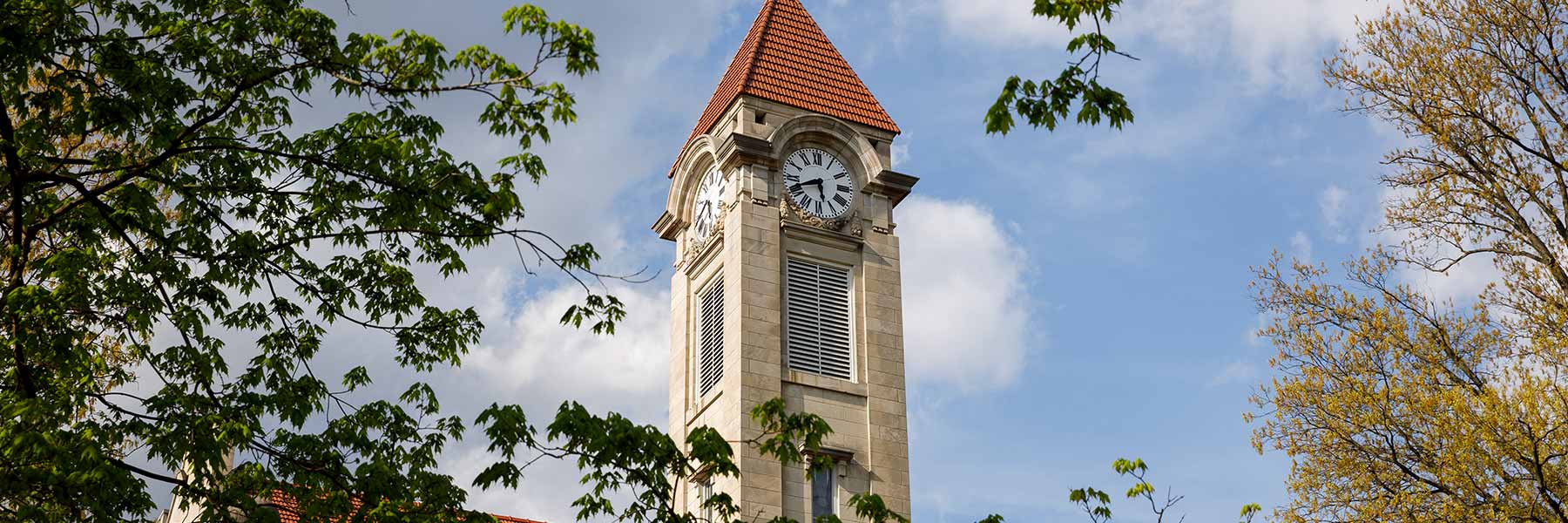 The Student Building clock tower on a spring afternoon