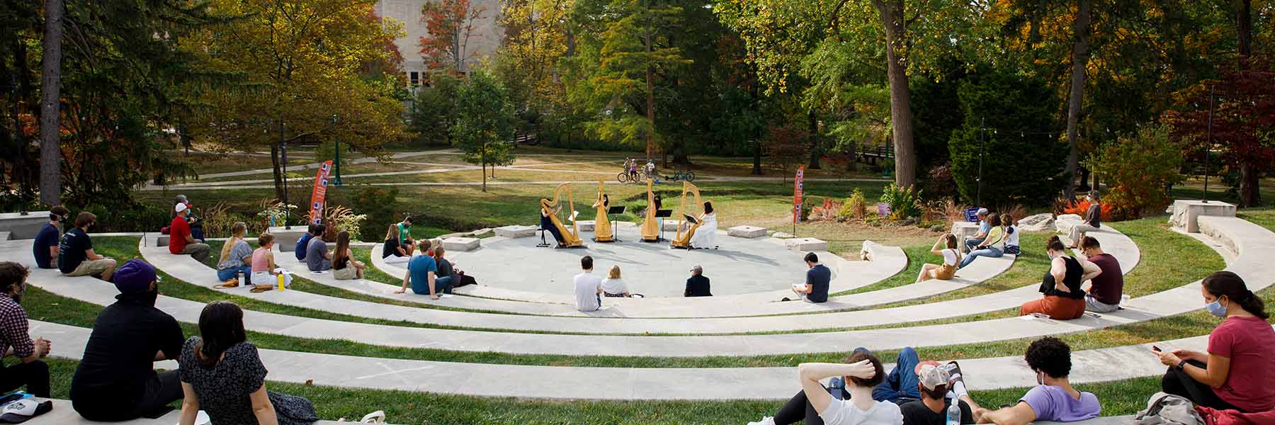 Harpists perform at the Conrad Prebys Amphitheater on a fall day at Indiana University Bloomington